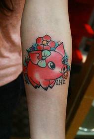 Girl's arm can be seen piglet tattoo pattern