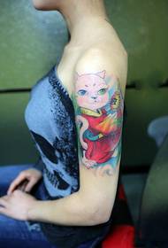 Girl's arm wearing red robe cat tattoo picture