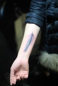 Small fresh feather arm tattoo picture