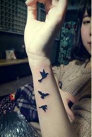 Fashionable female arm beautiful looking swallow tattoo pattern picture