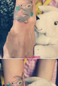 Cute doll rabbit arm tattoo picture