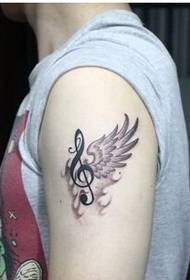 Fashion boy arms wings with musical tattoo pattern