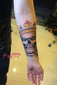 Vintage skull crown arm tattoo picture