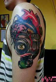 Creative heart with camera arm tattoo picture