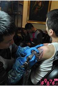 Man arm cross pterosaur tattoo process picture