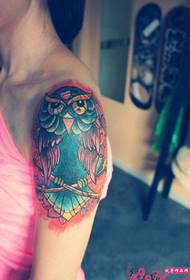 Painted owl arm tattoo picture