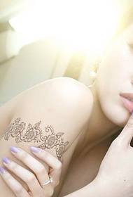Beauty lace arm tattoo