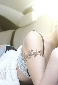Sexy beautiful woman in the BMW car arm flower vine pattern picture