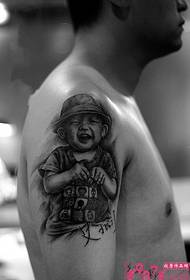 Black and white kids portrait arm tattoo
