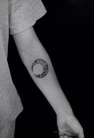 Creative moon totem arm tattoo
