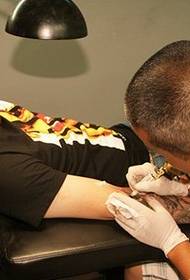 Tattoo artist arm tattoo pattern making process