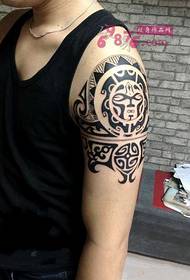 Larawan ng Batang Maya Totem Arm Tattoo