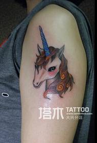 Girl arm colored unicorn tattoo