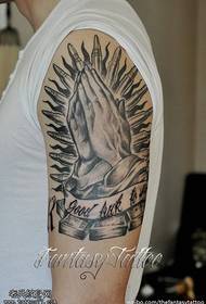 Wzór tatuażu ramię czarny szary bóg ręka
