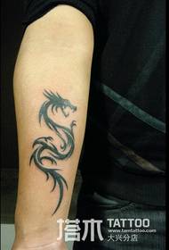 Men's arm dragon totem tattoo