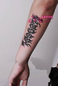 Creative text totem arm tattoo picture