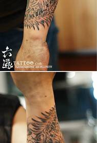 Arm abstract ink painting dragon and bone tattoo pattern