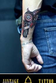 Arm color pistol tattoo pattern