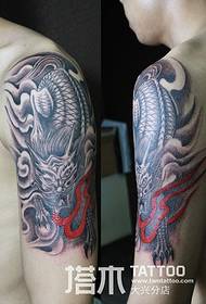Boy arm unicorn tattoo