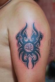 Simple totem tattoo on the big arm
