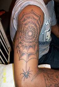 Handsome arm spider web tattoo