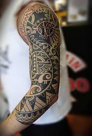 Stylish totem flower arm tattoo