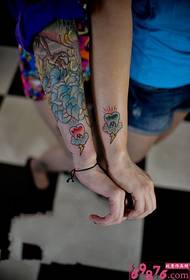 Girlfriend arm teeth tattoo