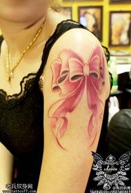 Female arm color bow tattoo picture