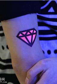 Female arm fluorescent diamond tattoo pattern