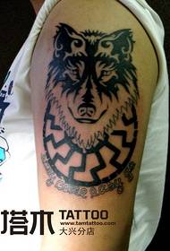 Boy arm wolf totem tattoo