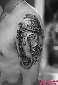 Black and white elephant god arm tattoo