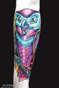 Isithombe se-Arm color owl tattoo