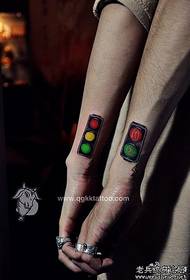 Alternative fashion couple tattoo: arm couple traffic light tattoo pattern
