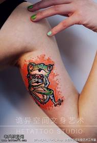 The tattoo museum recommends an arm colored frog tattoo work