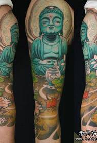Tatueringsshow, rekommenderar ett armfärgat Buddha tatueringsarbete