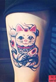 Arm beckoning cat tattoo work