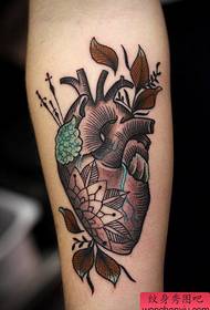 An arm black and white sketch heart tattoo works by tattoos