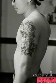 Arm black and white peony tattoo work