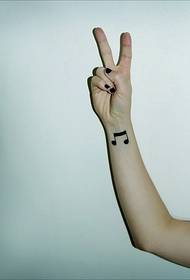 Cute girl arm wrist note tattoo pattern work photo