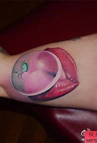 Arm and lip tattoo