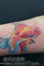 Girl likes arm colored small goldfish tattoo pattern