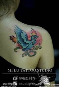 Woman shoulder color peace dove key tattoo work