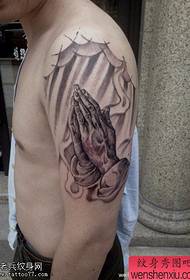 Arm black and white prayer hand tattoo work