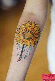 Arm colored sunflower tattoo work