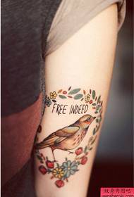 Girl arm bird small flower color tattoo pattern