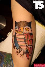 a creative owl tattoo work on the arm