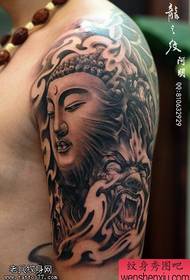 Tatueringsshow, rekommenderar en stor arm Buddha tatueringsarbete