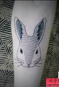 An abstract rabbit tattoo work is shared by the tattoo show