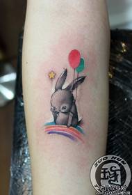 Girl's arm cute balloon bunny tattoo pattern