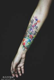 Woman arm splash ink compass tattoo